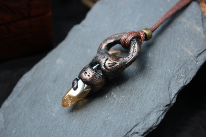 Close-up view of the handmade relic pendant with detailed antique textures