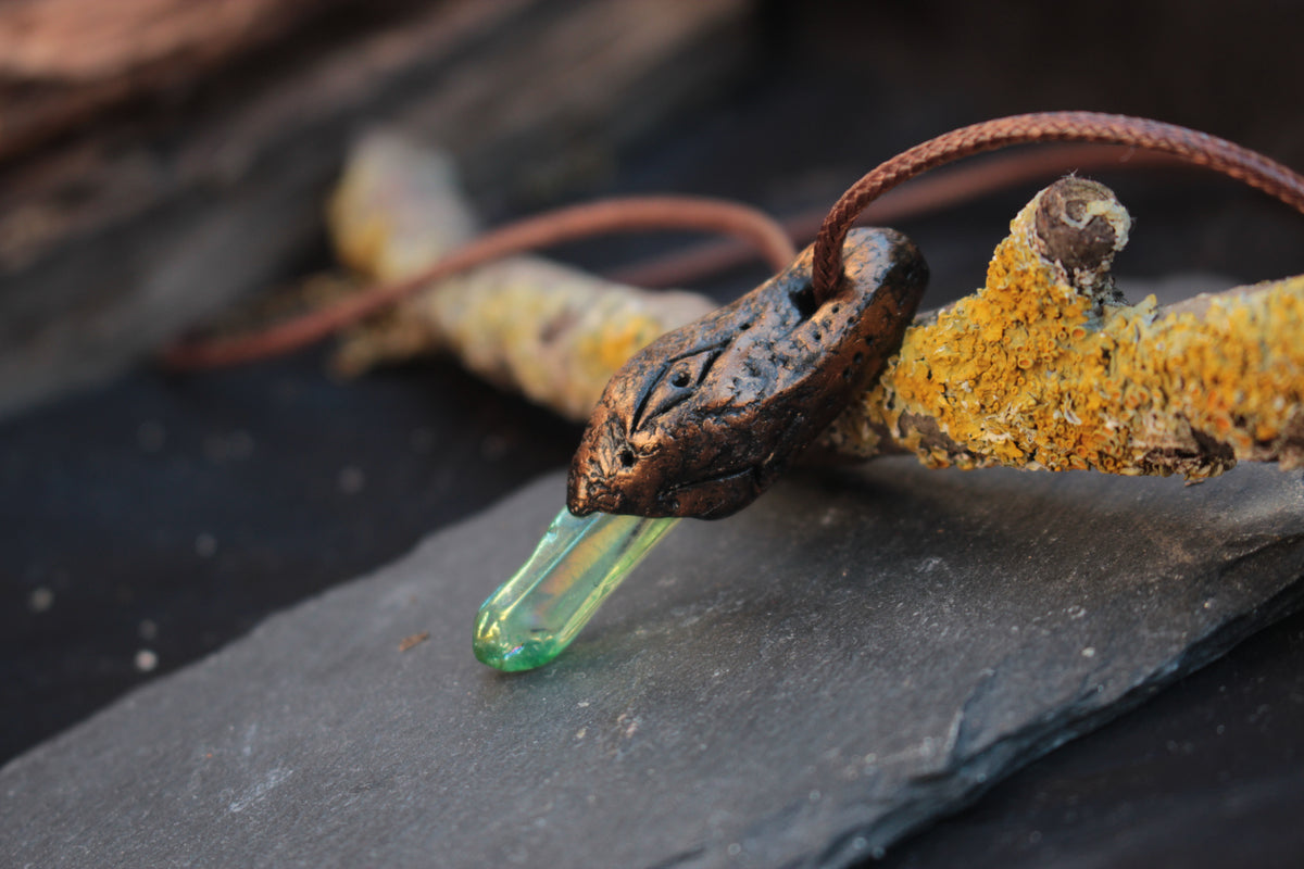 Close-up of a green forest-inspired pendant necklace