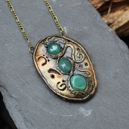 Handmade fantasy amulet with three green agate gemstones and ancient runes