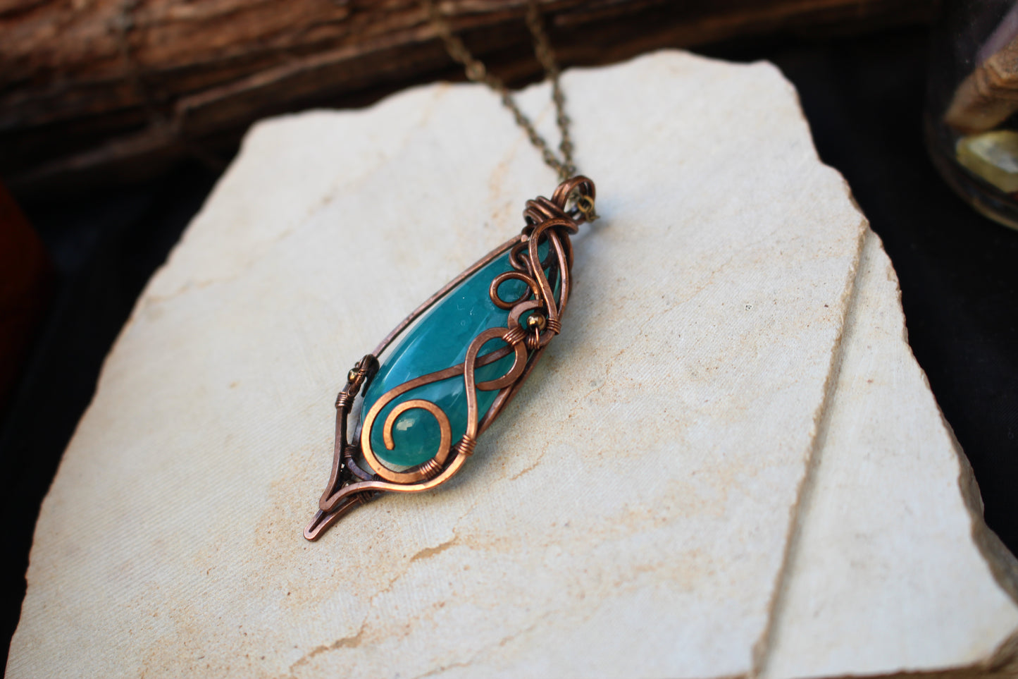 Handmade artisan blue agate gemstone pendant with copper wire detailing