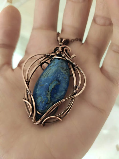 Artisan handmade copper pendant featuring natural blue crazy agate stone