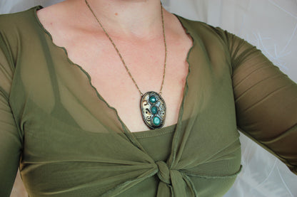 Artisan fantasy necklace featuring polished green agate cabochons