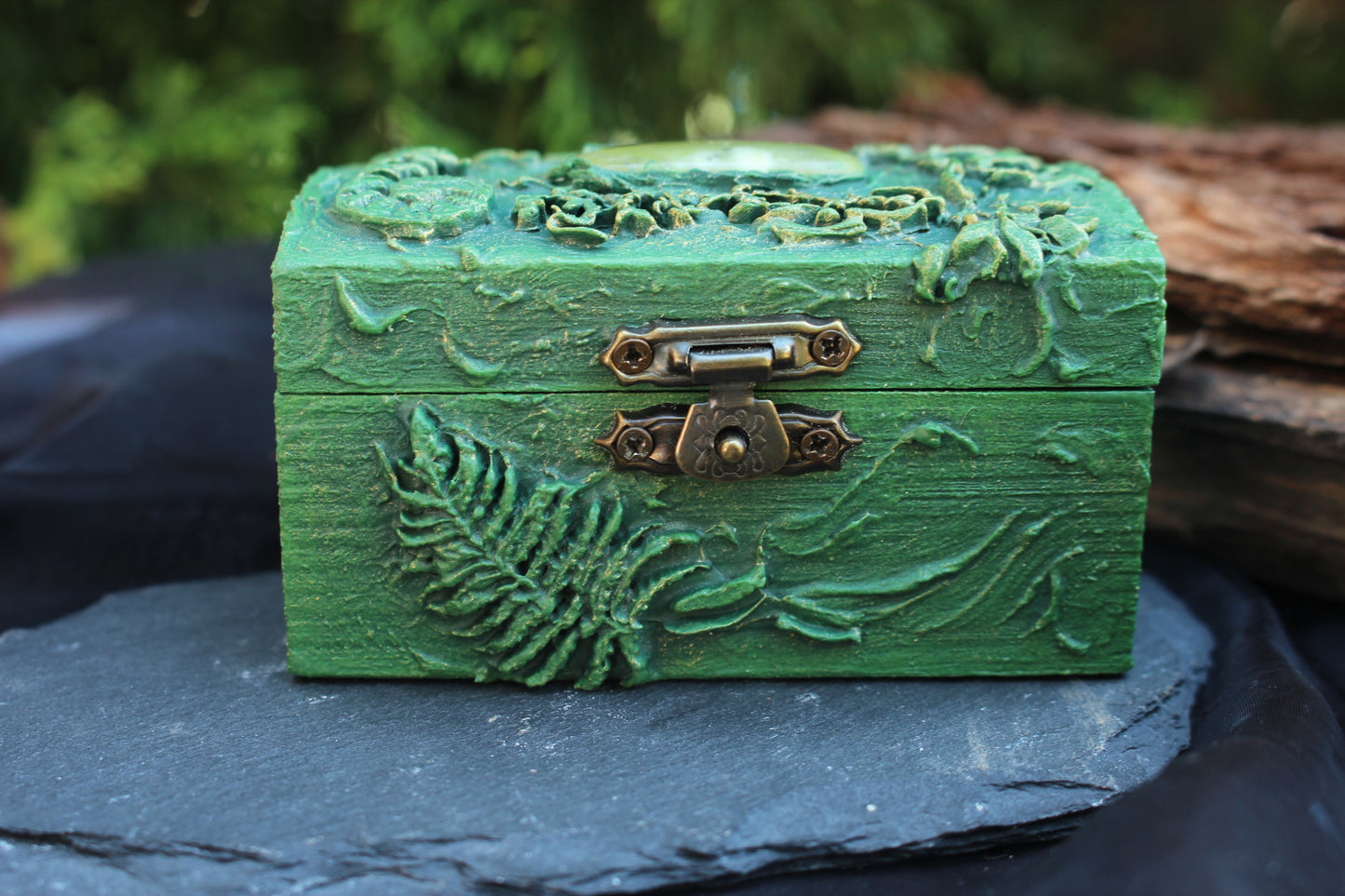 Artisan wooden treasure chest with jade gemstone detail