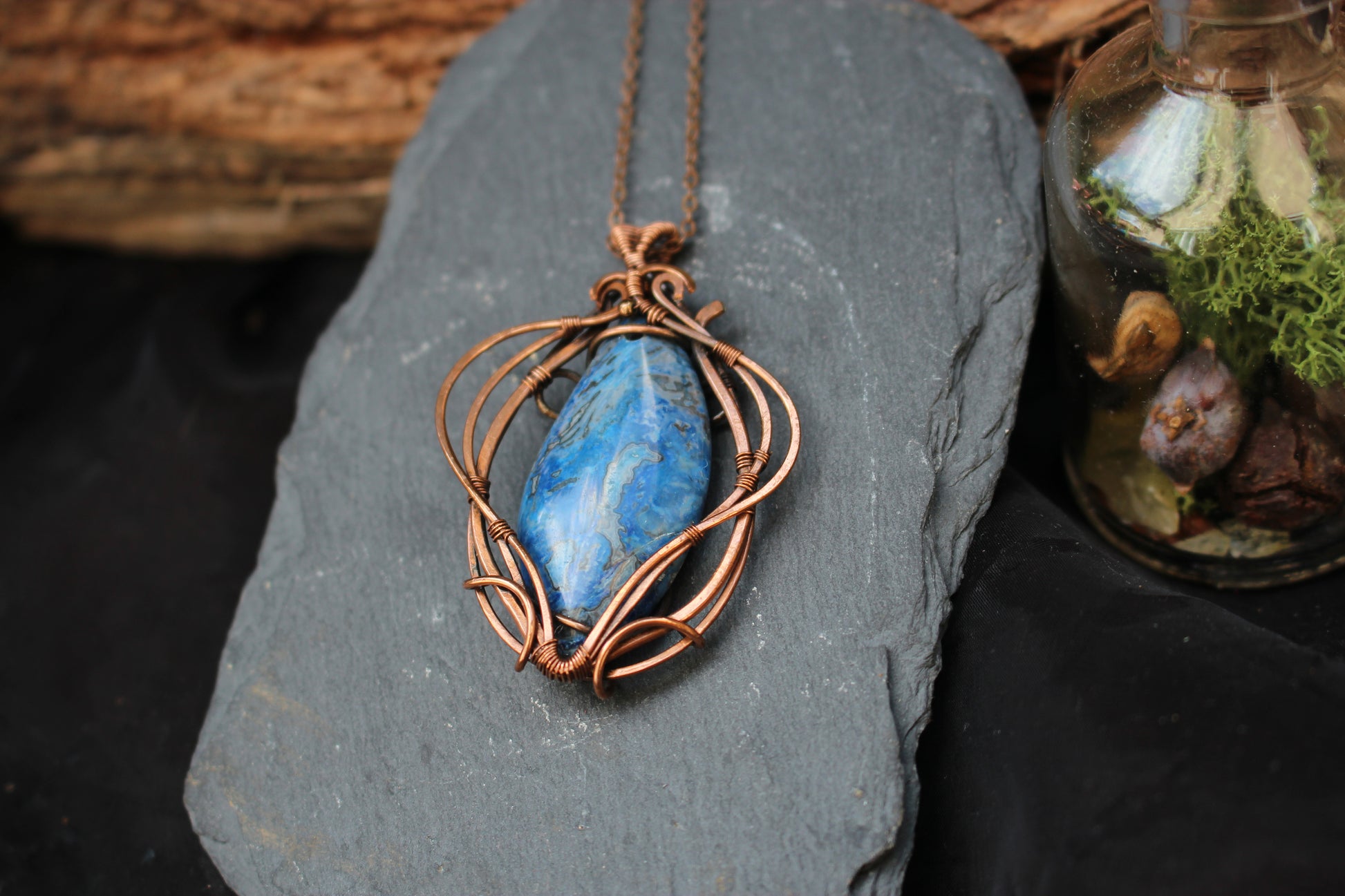 Artisan blue crazy agate pendant featuring elegant copper wire wrapping