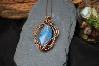 Artisan blue crazy agate pendant featuring elegant copper wire wrapping