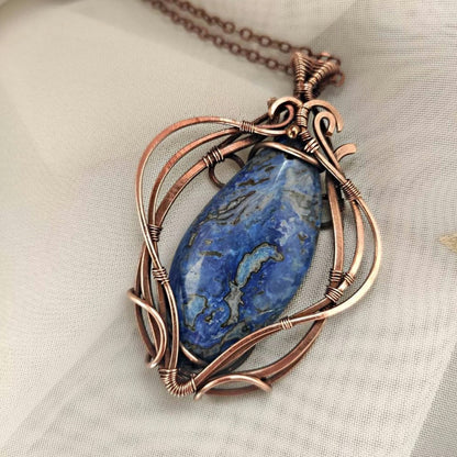Handmade blue crazy agate copper wire wrapped pendant with patinated finish