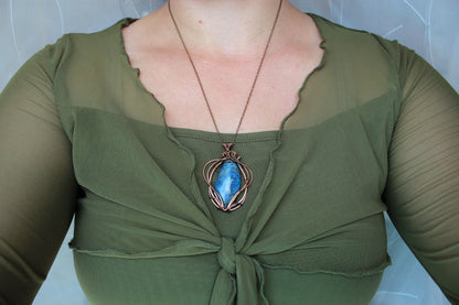 Blue crazy agate gemstone and copper wire wrapping detail in handcrafted pendant