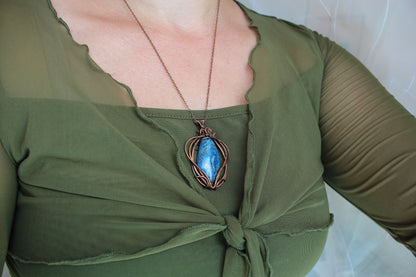 Handmade blue crazy agate pendant wrapped in copper wire, shown from the front