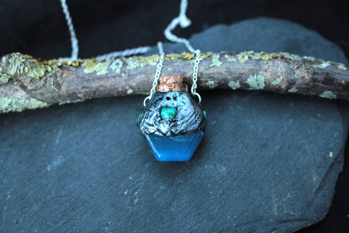 Handmade blue fantasy potion necklace with a tiny glass vial pendant