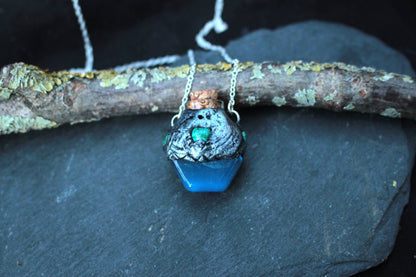 Handmade blue fantasy potion necklace with a tiny glass vial pendant