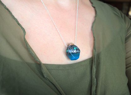 Blue glowing fantasy necklace with handmade potion bottle pendant