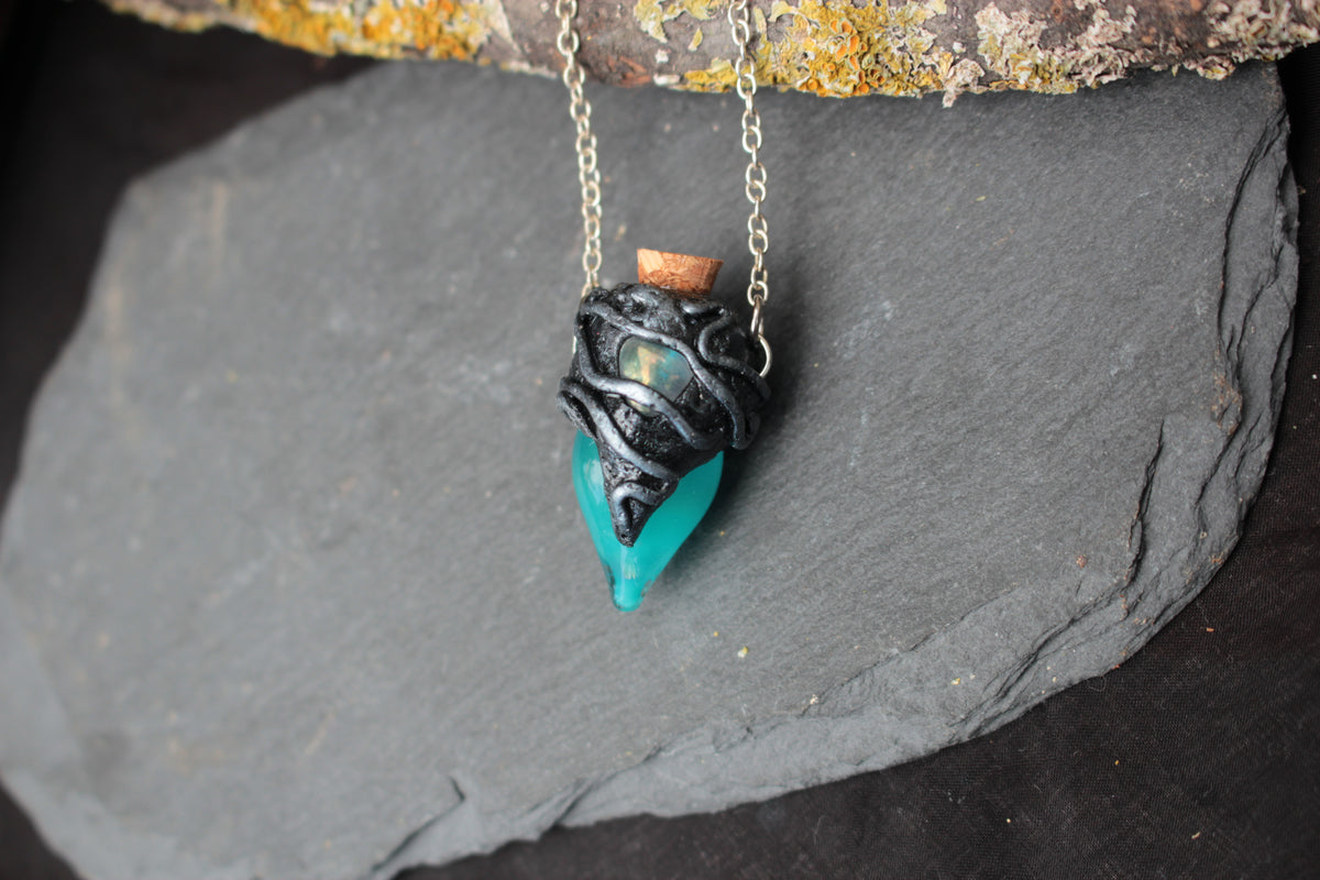 Blue glowing magic bottle necklace with sterling silver chain