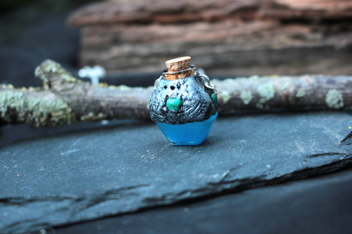 Small blue magical vial pendant with antique bronze finish