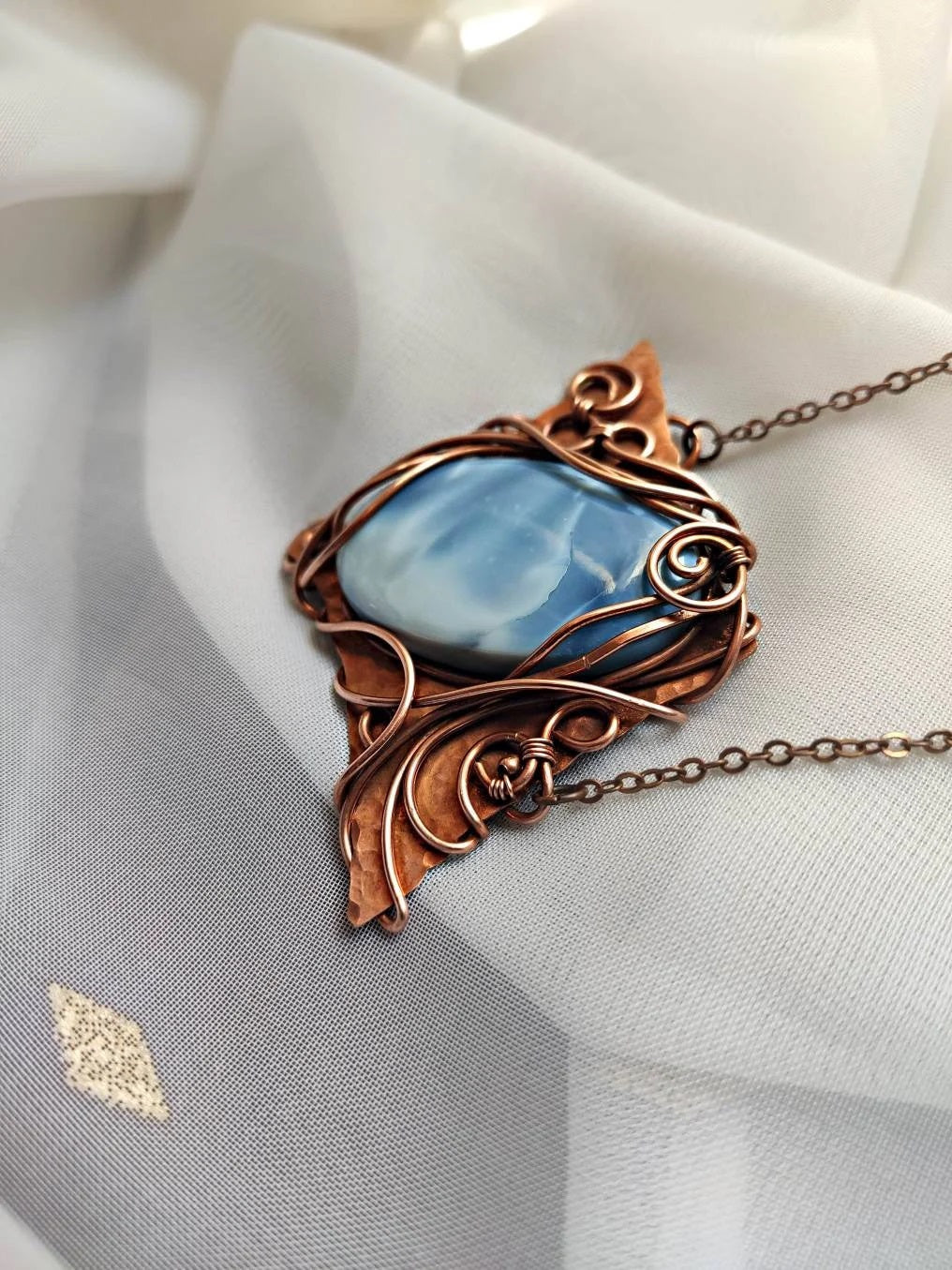 Elegant blue opal gemstone necklace with handcrafted copper wire wrapping