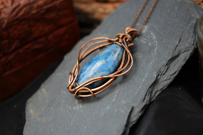 Bohemian blue crazy agate pendant wrapped in artistic copper wire design
