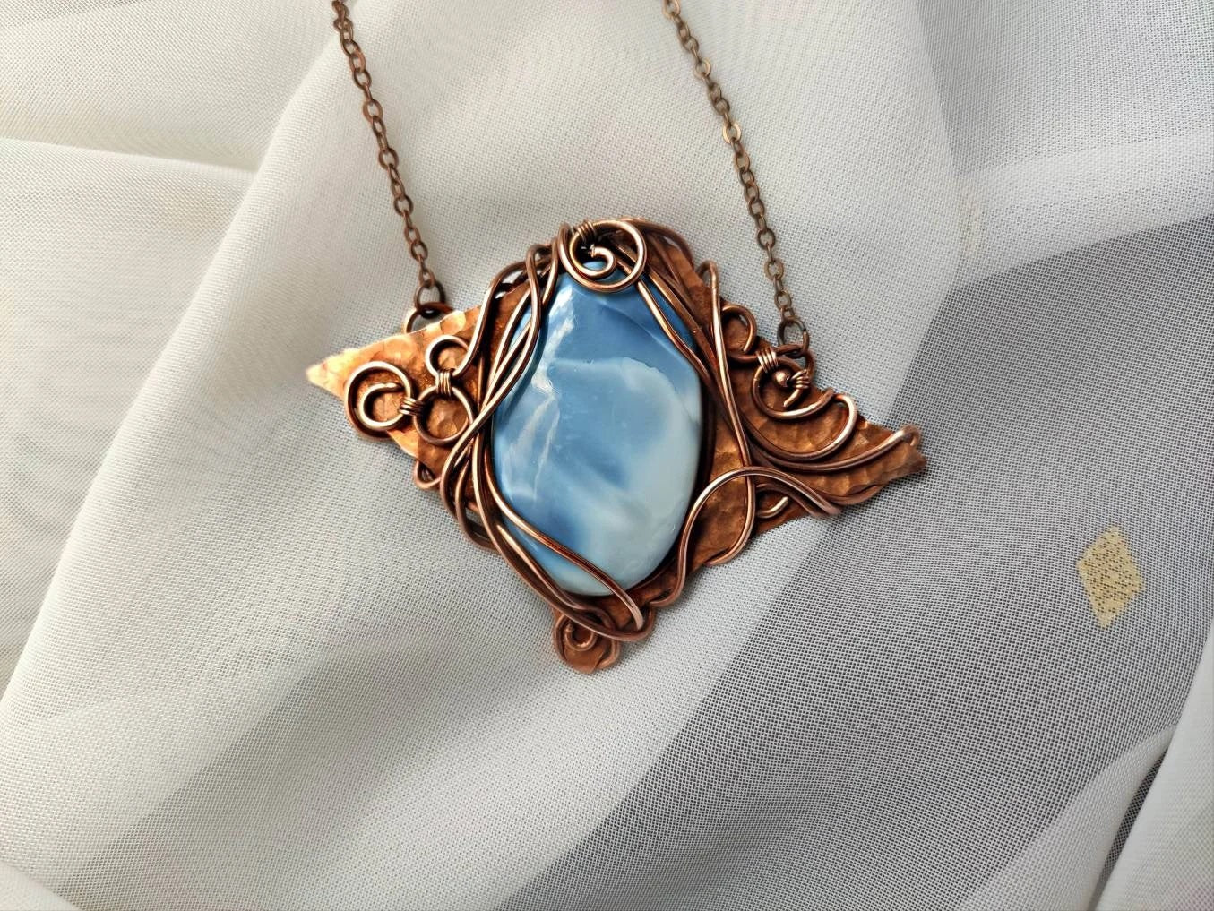 Bohemian inspired blue opal copper necklace with detailed wire wrapped pattern