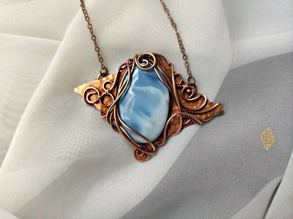 Bohemian inspired blue opal copper necklace with detailed wire wrapped pattern