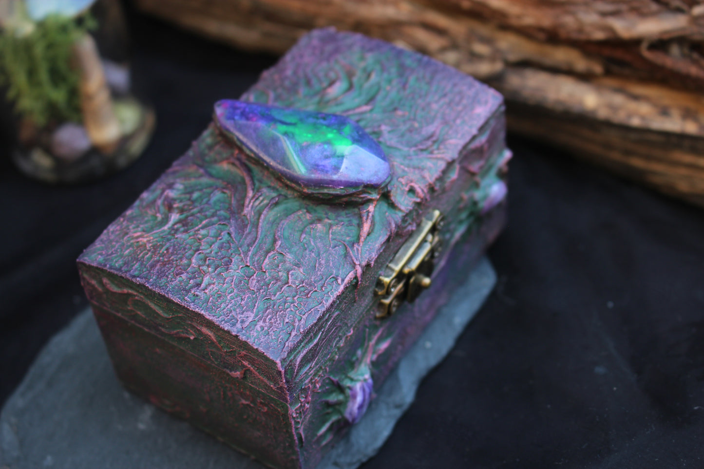 Wooden jewelry box decorated with glowing resin crystal