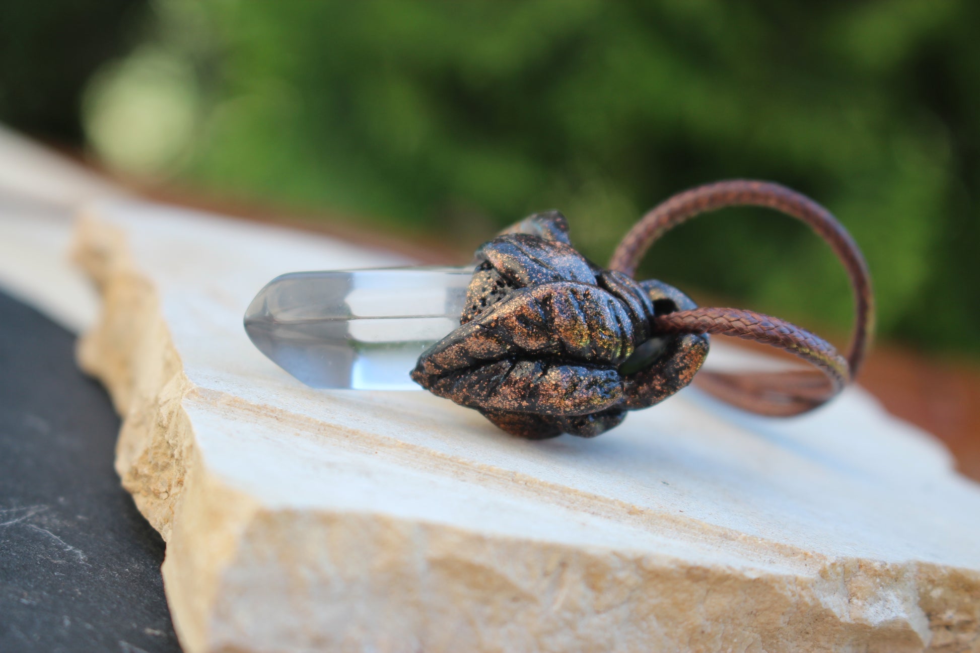 Leaf pendant with genuine Quartz Crystal and bronze finish