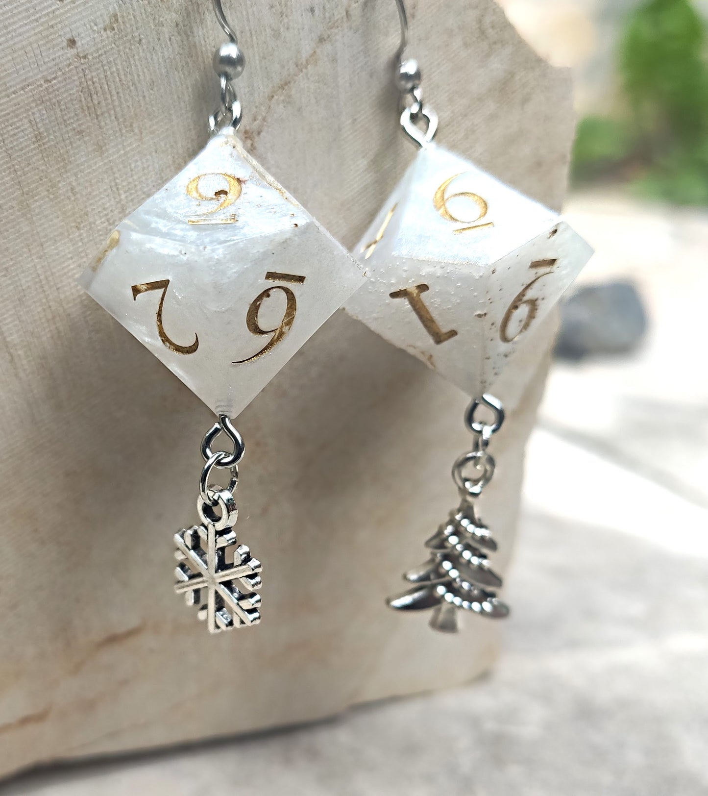 Close-up of Christmas inspired D10 dice earrings