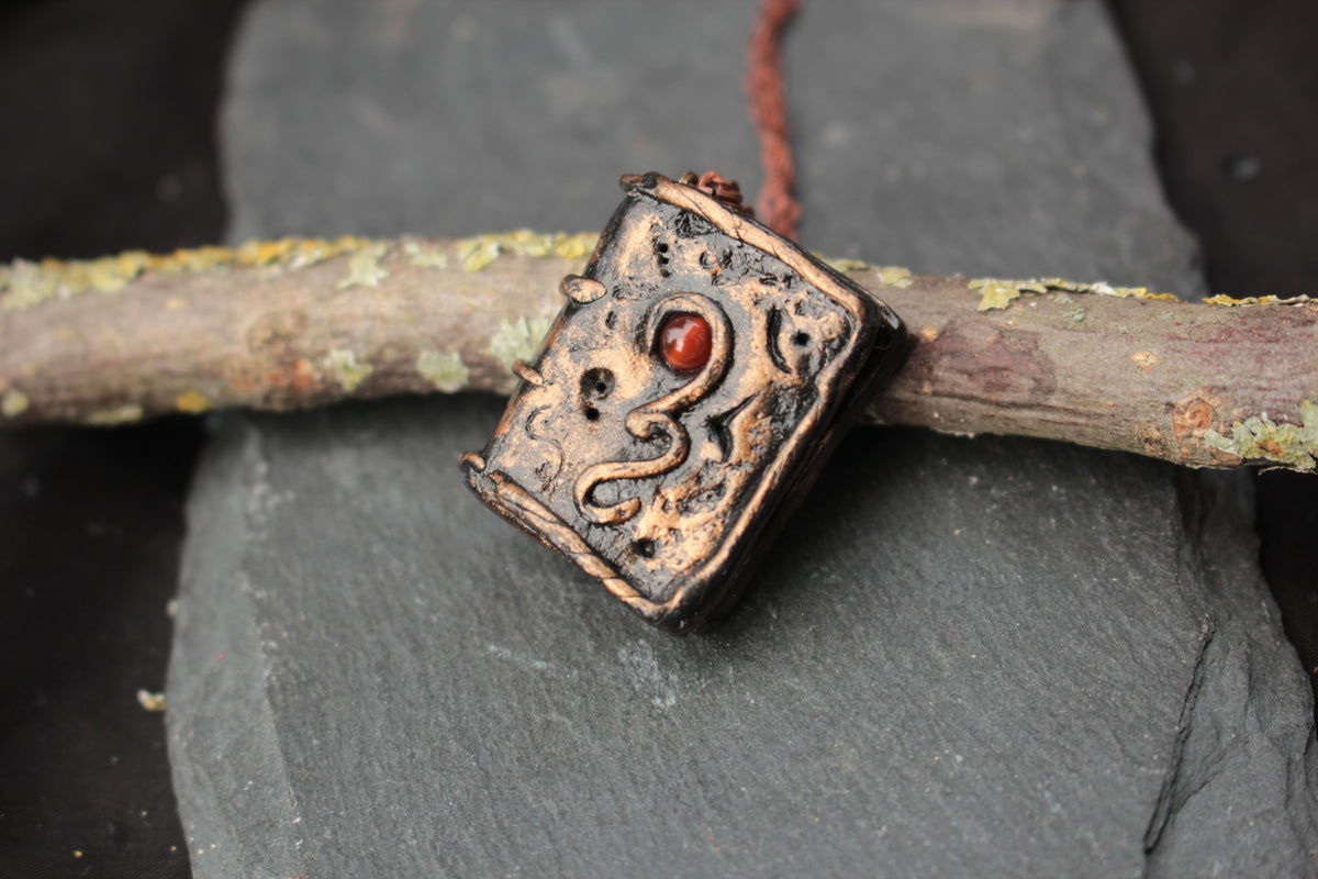 D&D inspired magic book pendant necklace for fantasy adventurers