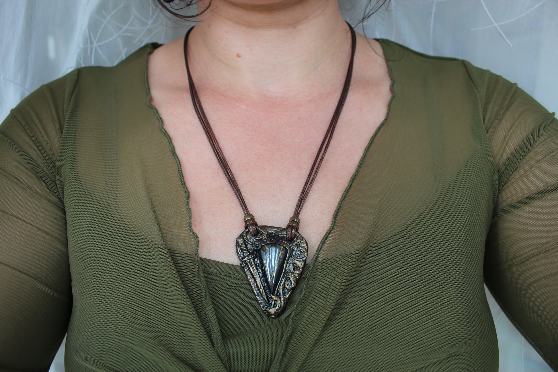 Dark academia style fantasy necklace with ancient look