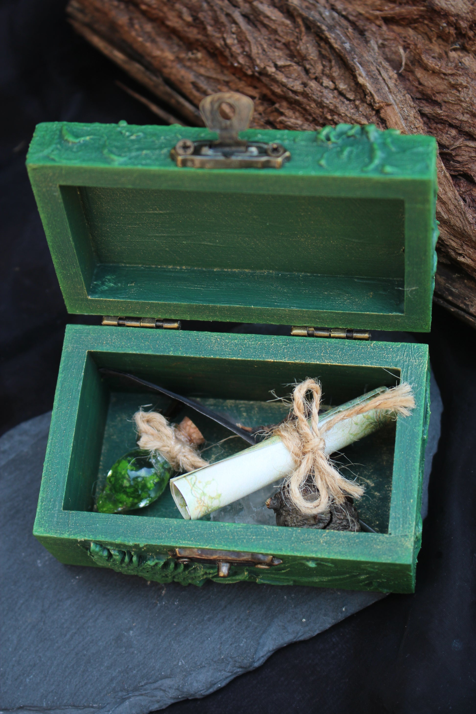 Decorative wooden chest with gemstone accent on top