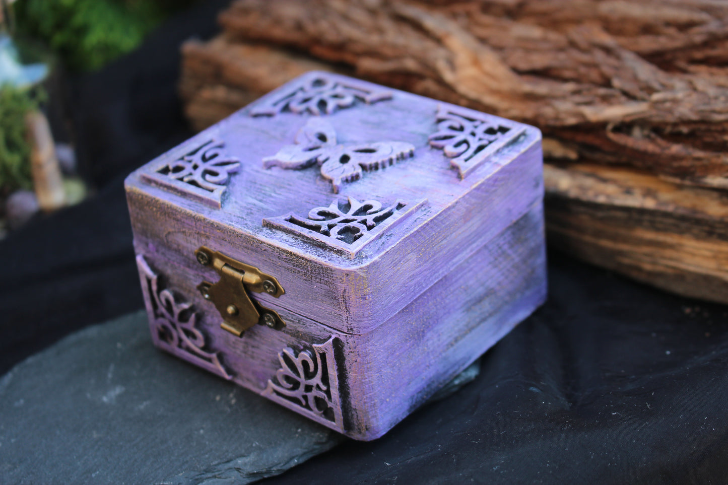 Decorative purple wooden jewelry storage box with gold accents