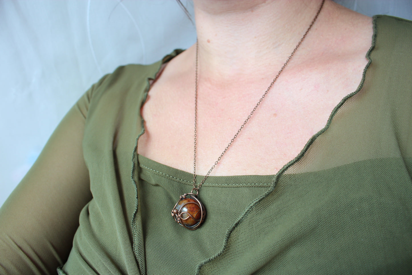 Dragon vein agate stone and intricate copper wire wrapping in handcrafted boho necklace