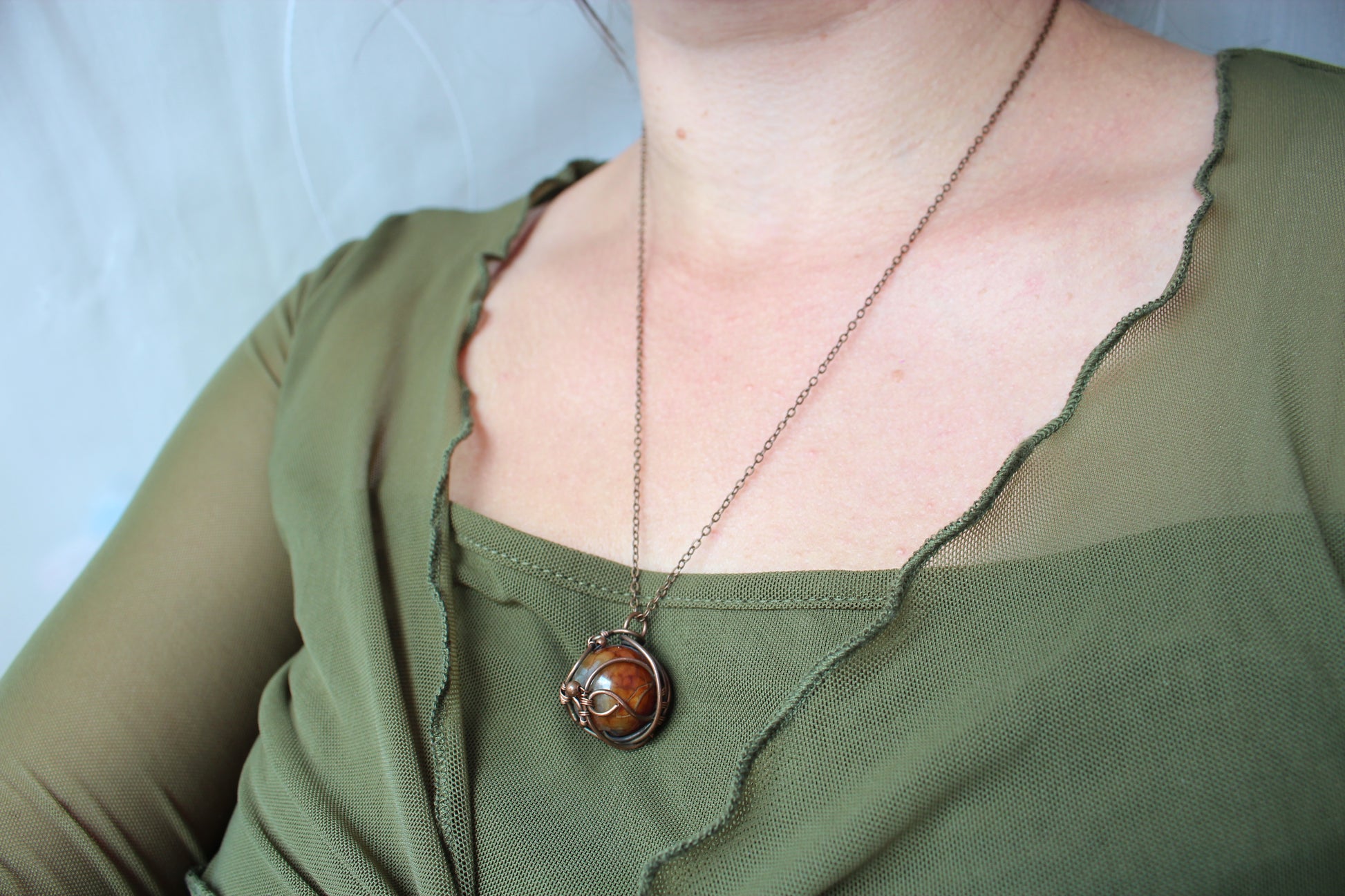 Dragon vein agate stone and intricate copper wire wrapping in handcrafted boho necklace