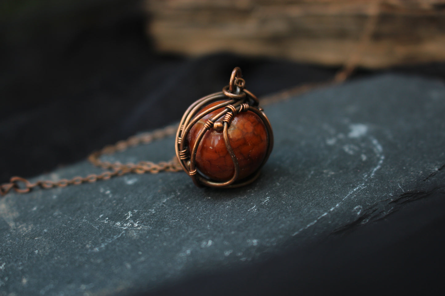Handmade dragon vein agate gemstone jewelry in elegant copper wire wrap