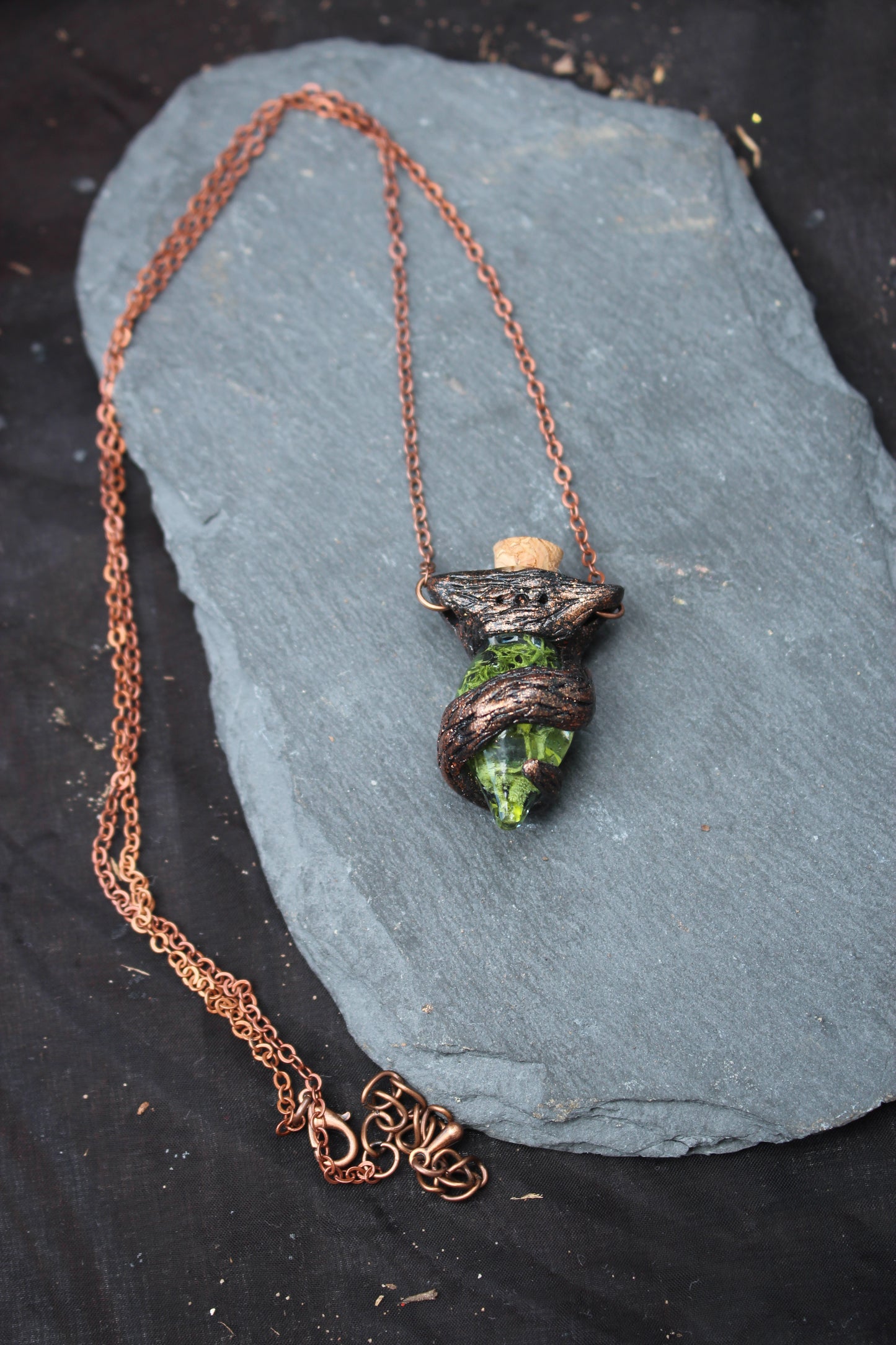 Handmade druid-inspired fantasy necklace with a moss-filled bottle pendant