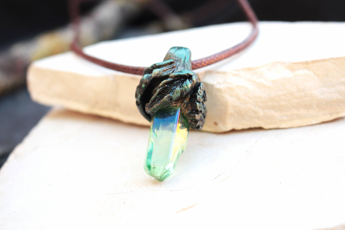 Druid-inspired fantasy jewelry featuring a mystical green and blue crystal