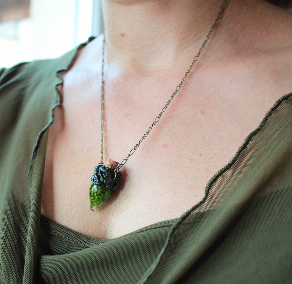 Druid-inspired fantasy necklace featuring a green moss vial