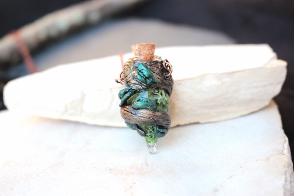 Handmade druid jewelry with a tiny forest potion bottle pendant