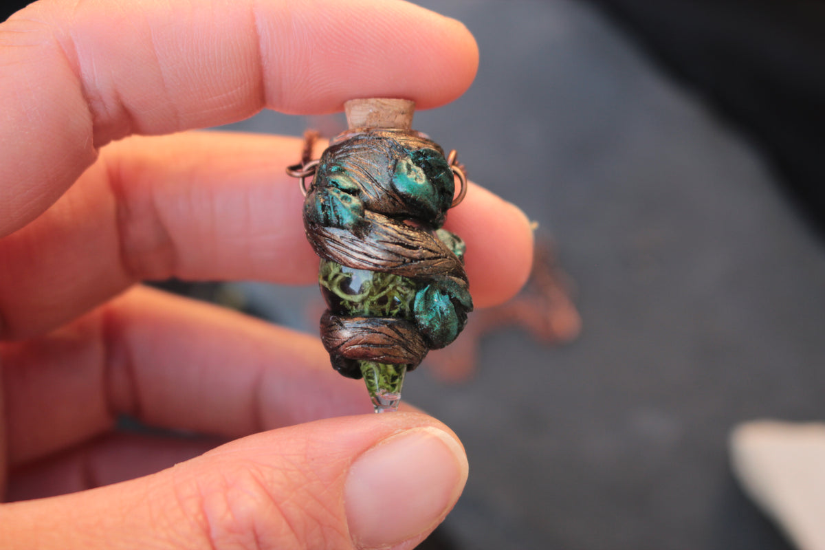 Handmade druid necklace with a tiny magical moss potion pendant