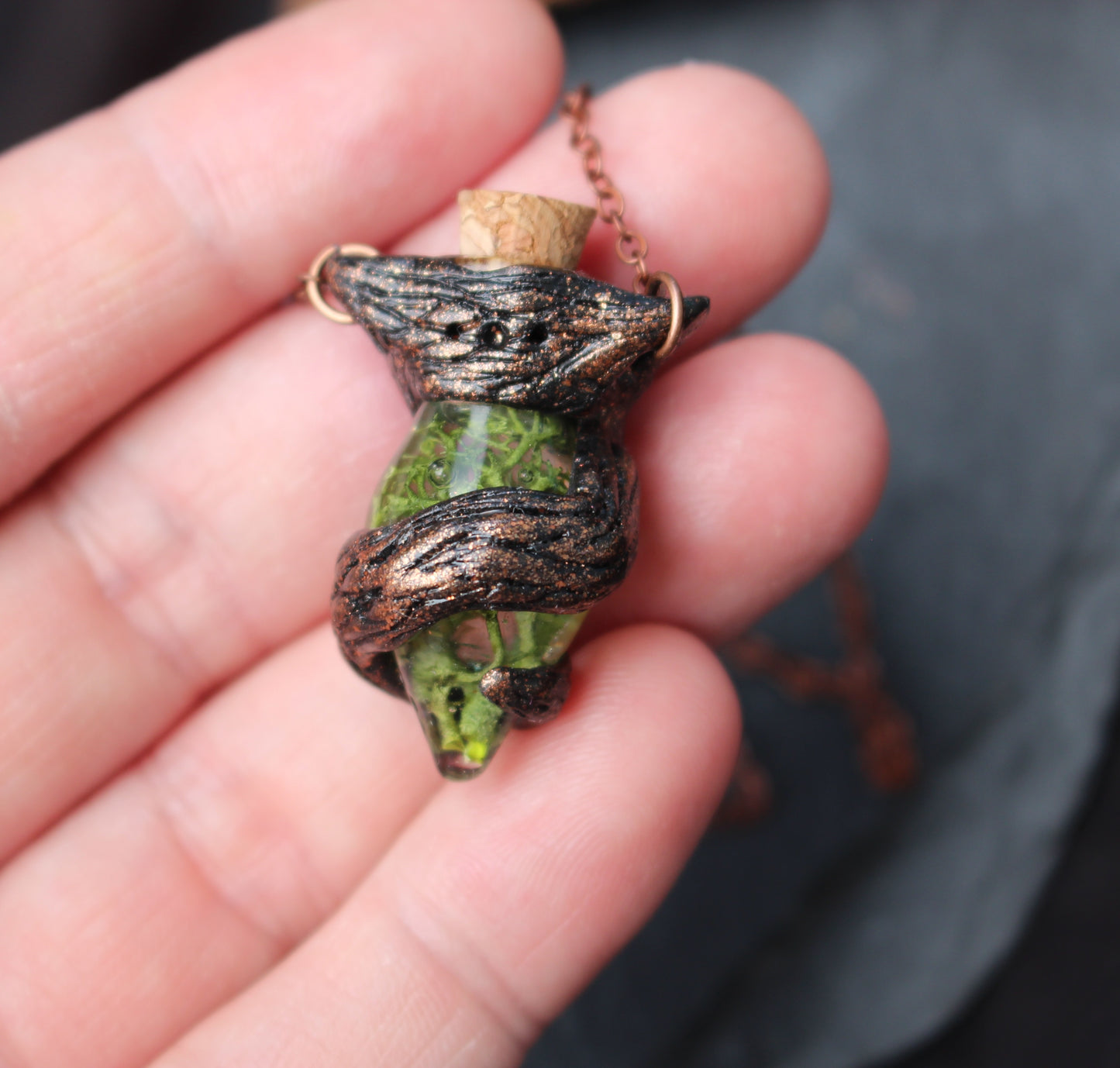 Fantasy concept illustration of the Druid Moss Potion pendant inspired by magical artifact sketches