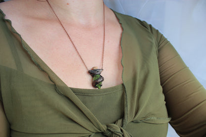 Model wearing the handmade Druid Moss Potion necklace, showcasing the woodland-inspired pendant and adjustable chain