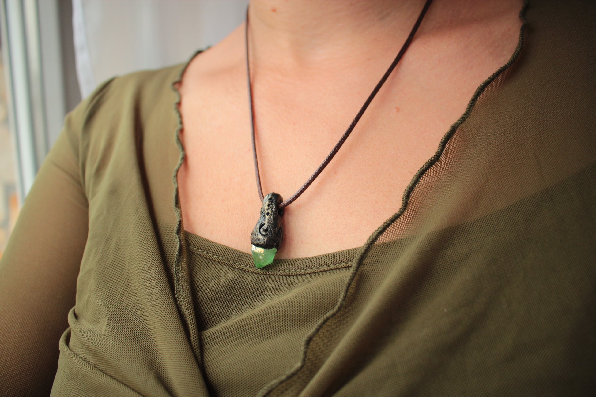 Fantasy inspired necklace with an elegant green crystal woodland design