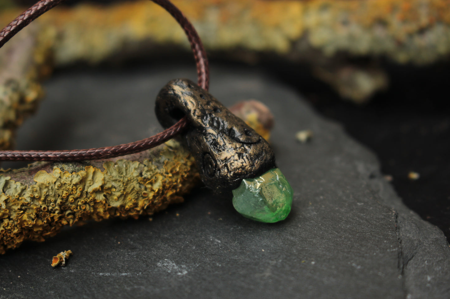 Mystical talisman necklace designed with a glowing forest fantasy aesthetic