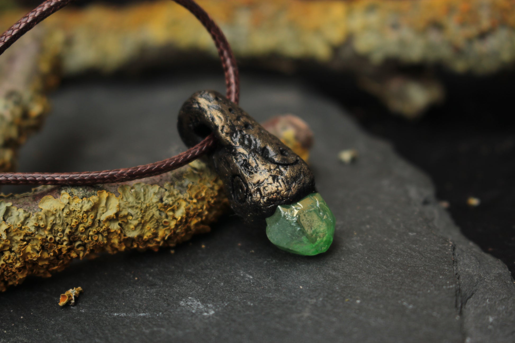 Mystical talisman necklace designed with a glowing forest fantasy aesthetic