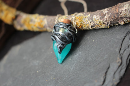 Handmade turquoise potion bottle pendant worn as a fantasy necklace