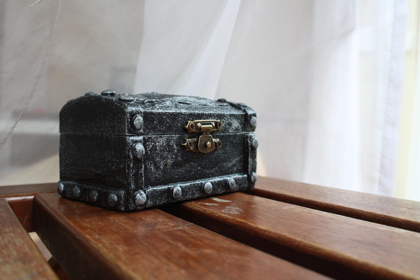 Handmade RPG treasure chest with metal dice set for tabletop games