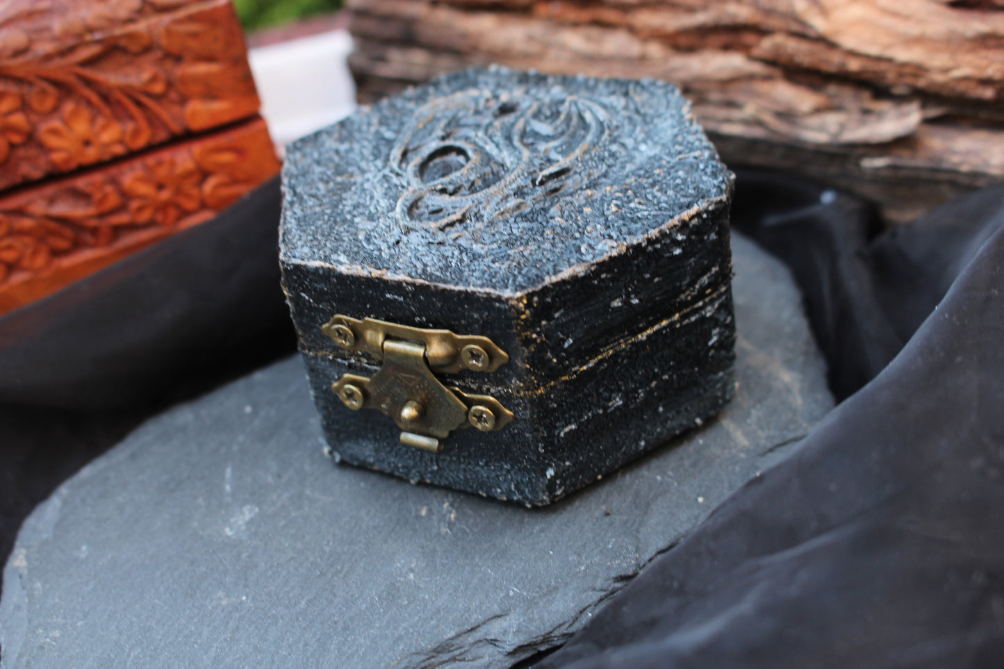 Small fantasy wooden treasure chest with dragon-inspired design