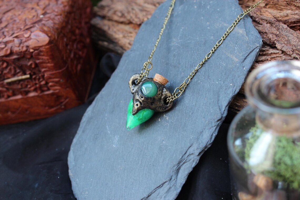 Handmade fantasy potion pendant with an antique bronze finish