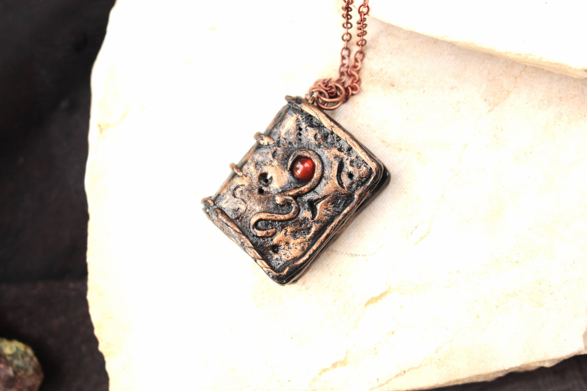 Handmade magic book necklace inspired by ancient fantasy spellbooks