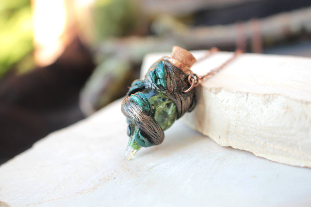 Fantasy necklace featuring a miniature potion pendant inspired by woodland magic