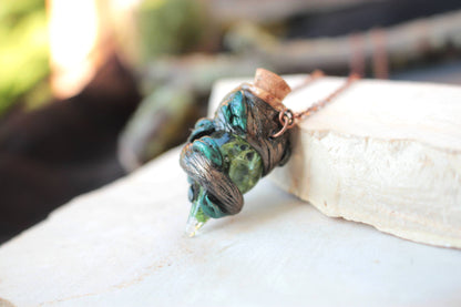 Fantasy necklace featuring a miniature potion pendant inspired by woodland magic