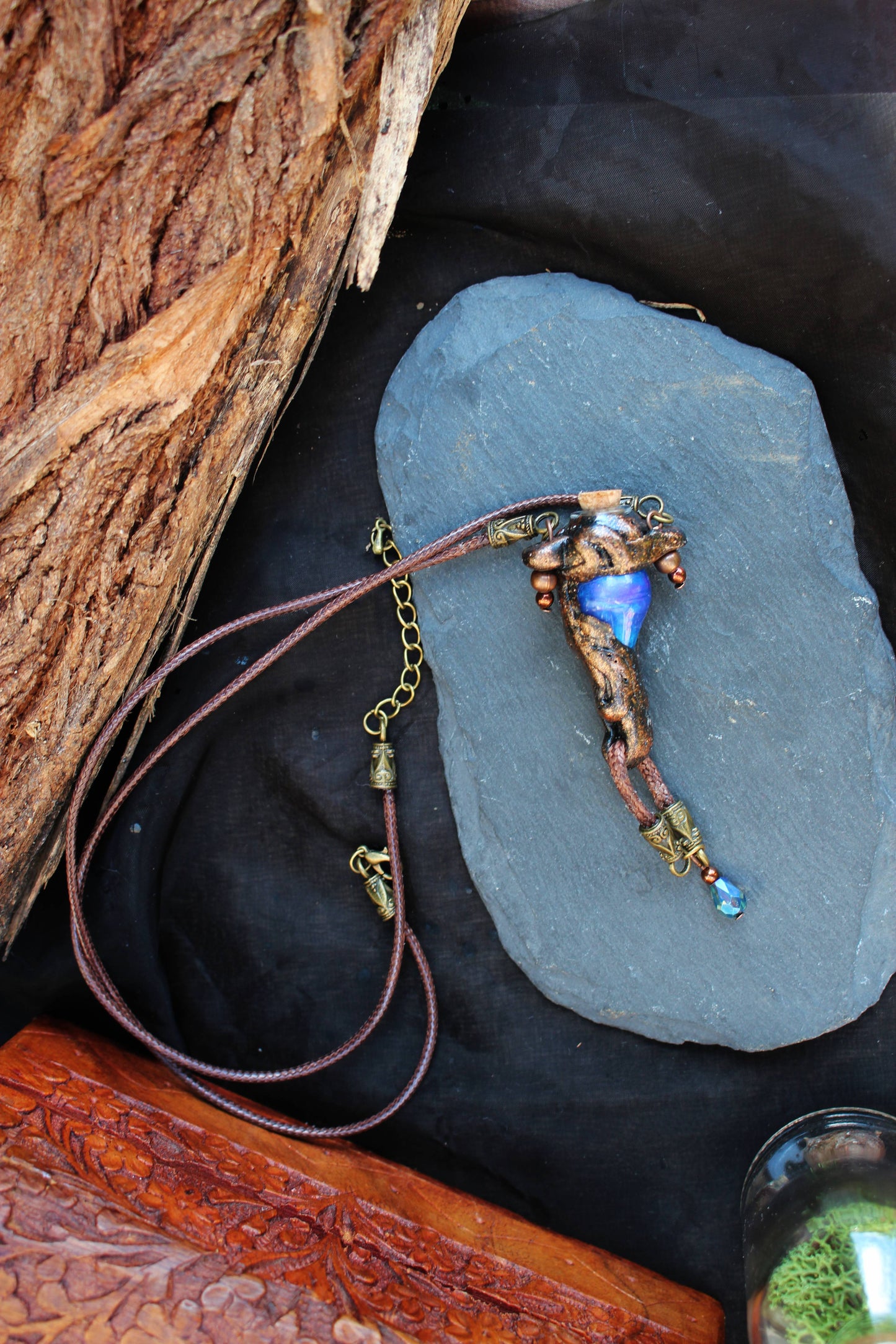 Handmade fantasy necklace with metallic rune decoration