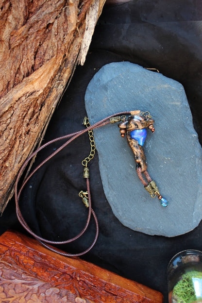 Handmade fantasy necklace with metallic rune decoration
